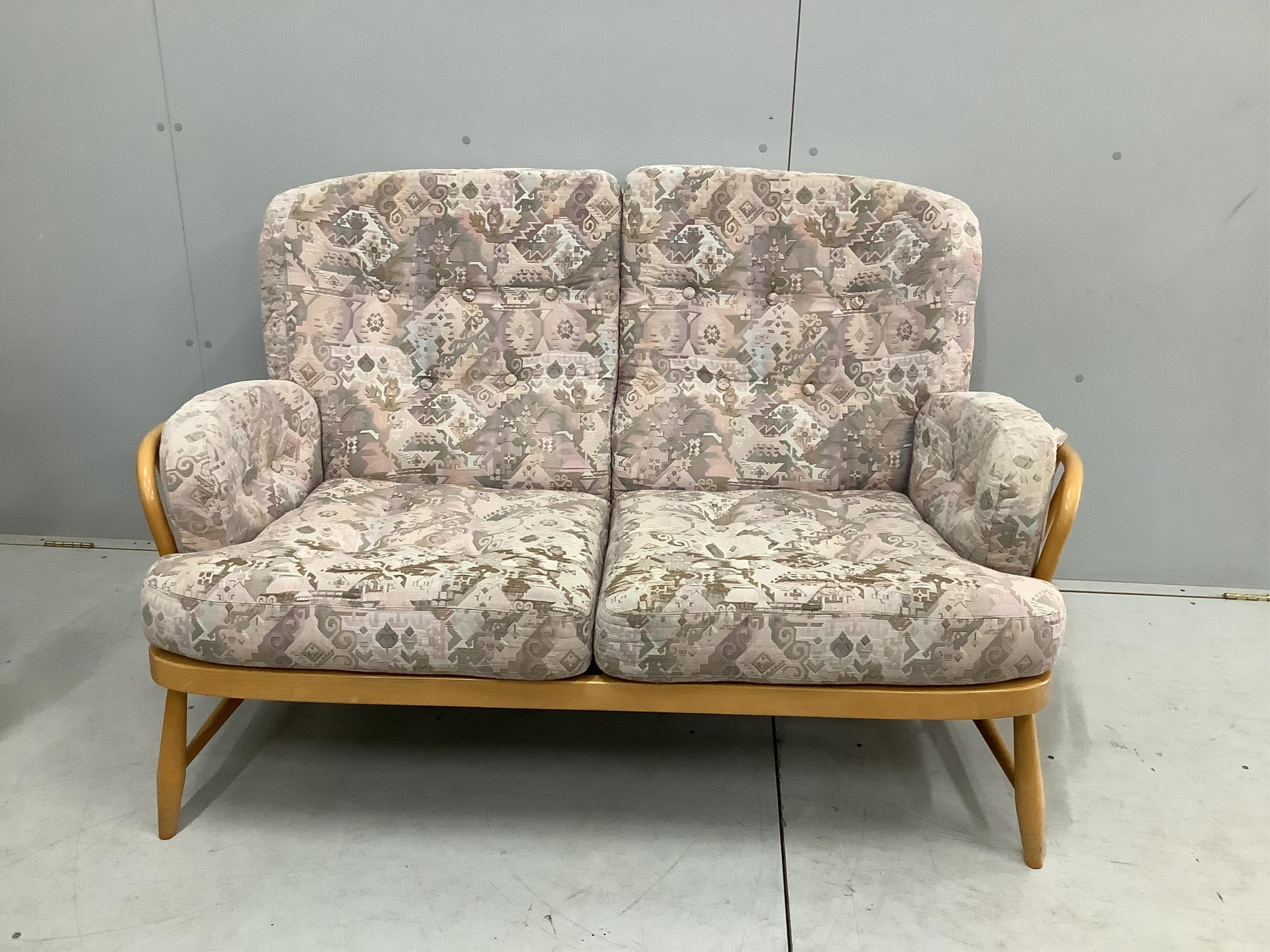 A pair of Ercol beech settees, width 140cm, depth 80cm, height 82cm